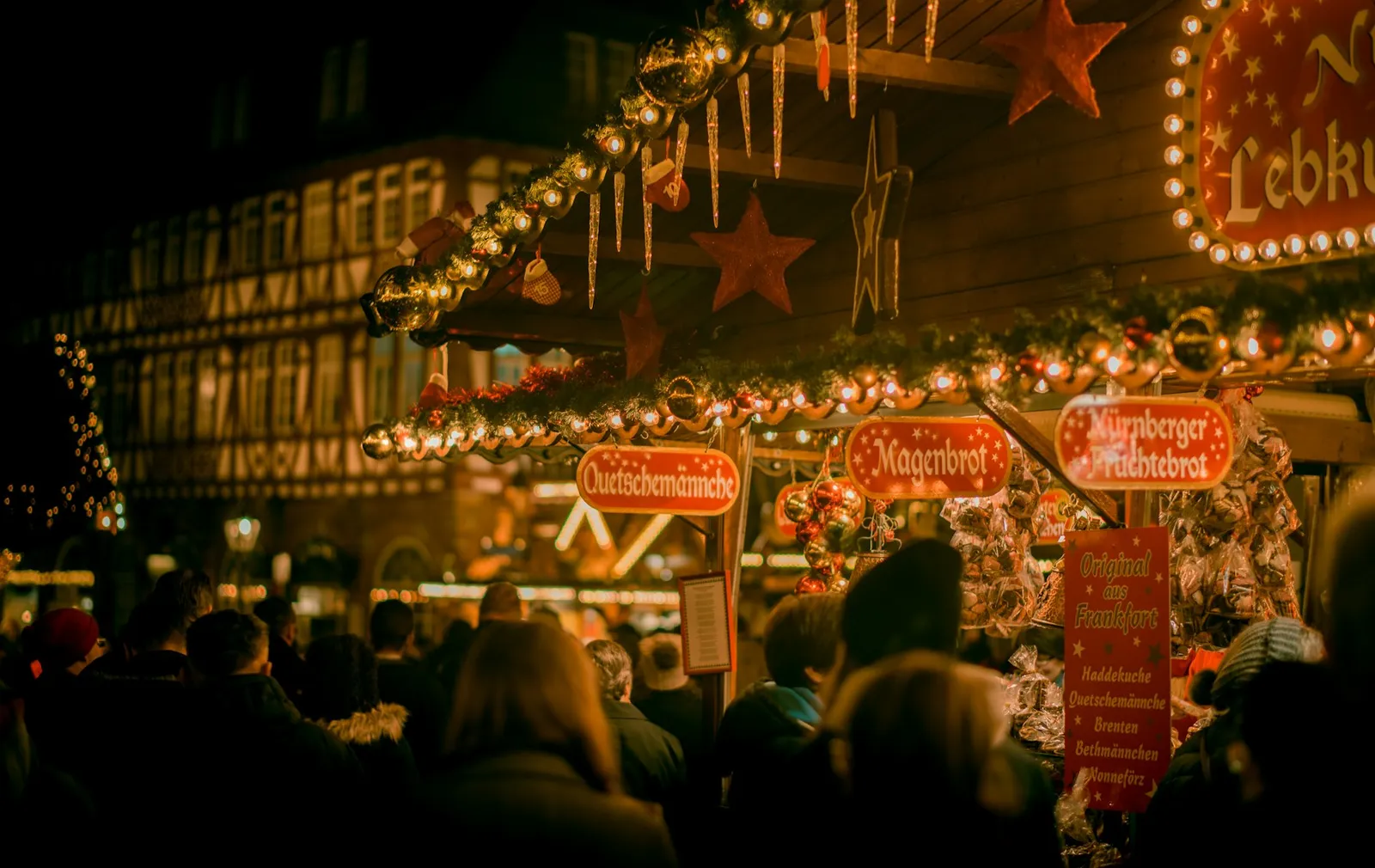 Holiday market stalls lit at night